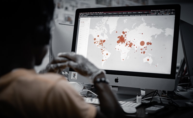 A team of cybersecurity professionals analyzing data on a computer